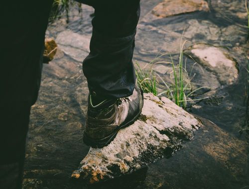 Close-up of feet on a mat, showing balance and stability.